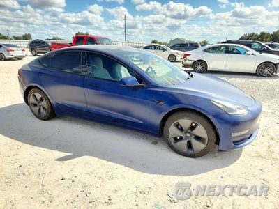 Czwarte zdjęcie samochodu z boku: 2022 TESLA MODEL 3 VIN:5YJ3E1EB3NF344719 - miniatura