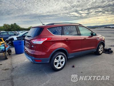 Trzecie zdjęcie samochodu z tyłu: 2016 FORD ESCAPE SE VIN:1FMCU9GXXGUB85696 - miniatura