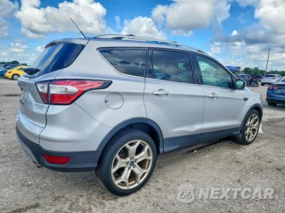Trzecie zdjęcie samochodu z tyłu: 2017 FORD ESCAPE TITANIUM VIN:1FMCU0J96HUA57995 - miniatura