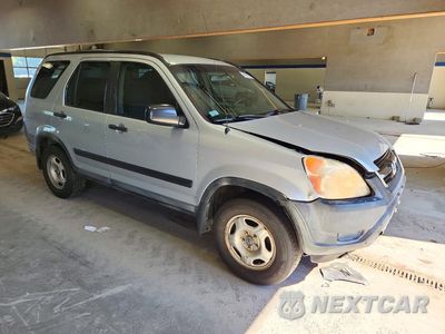 Czwarte zdjęcie samochodu z boku: 2004 HONDA CR-V LX VIN:SHSRD78444U239014 - miniatura