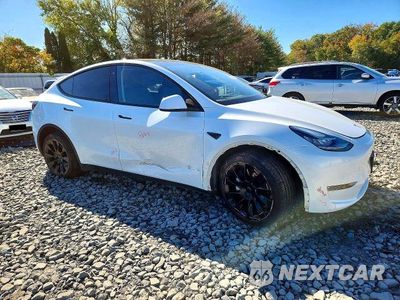Czwarte zdjęcie samochodu z boku: 2023 TESLA MODEL Y VIN:7SAYGDEE7PA059519 - miniatura