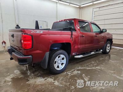 Trzecie zdjęcie samochodu z tyłu: 2016 CHEVROLET SILVERADO K1500 LT VIN:3GCUKREC6GG354968 - miniatura