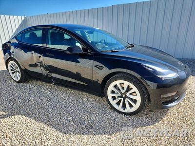 Czwarte zdjęcie samochodu z boku: 2022 TESLA MODEL 3 VIN:5YJ3E1EAXNF372413 - miniatura
