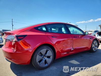 Trzecie zdjęcie samochodu z tyłu: 2022 TESLA MODEL 3 VIN:5YJ3E1EA9NF160991 - miniatura