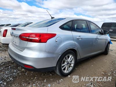 Trzecie zdjęcie samochodu z tyłu: 2017 FORD FOCUS SE VIN:1FADP3F25HL317294 - miniatura