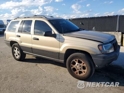 Czwarte zdjęcie samochodu z boku: 2000 JEEP GRAND CHEROKEE LAREDO VIN:1J4G248S2YC390853 - miniatura
