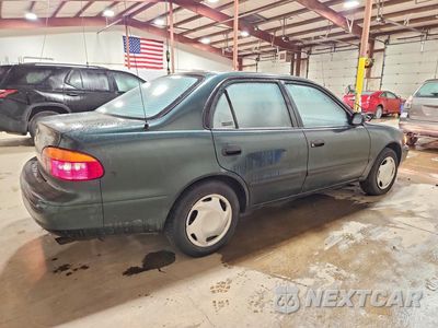 Trzecie zdjęcie samochodu z tyłu: 2001 CHEVROLET GEO PRIZM BASE VIN:1Y1SK52821Z412433 - miniatura