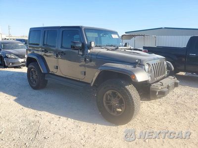 Czwarte zdjęcie samochodu z boku: 2016 JEEP WRANGLER UNLIMITED SAHARA VIN:1C4HJWEG2GL333432 - miniatura
