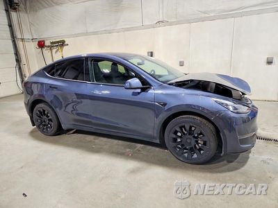 Czwarte zdjęcie samochodu z boku: 2022 TESLA MODEL Y VIN:7SAYGDEE3NF512101 - miniatura