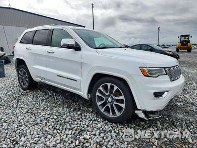 Czwarte zdjęcie samochodu z boku: 2017 JEEP GRAND CHEROKEE OVERLAND VIN:1C4RJFCG2HC772493 - miniatura