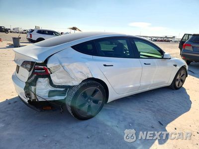 Trzecie zdjęcie samochodu z tyłu: 2022 TESLA MODEL 3 VIN:5YJ3E1EB0NF356889 - miniatura