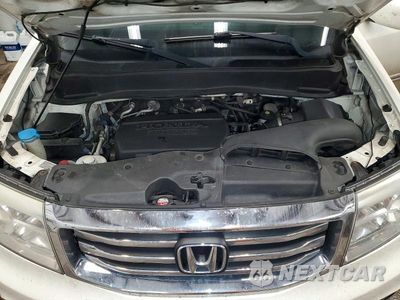 Zdjęcie 12 z 13 samochodu: 2014 HONDA PILOT TOURING VIN:5FNYF4H9XEB033415 - miniatura