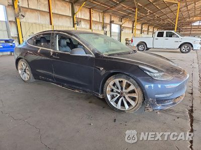 Czwarte zdjęcie samochodu z boku: 2019 TESLA MODEL 3 VIN:5YJ3E1EBXKF194622 - miniatura