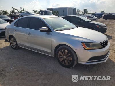 Czwarte zdjęcie samochodu z boku: 2016 VOLKSWAGEN JETTA SE VIN:3VWD67AJ6GM249049 - miniatura