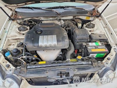 Zdjęcie 11 z 12 samochodu: 2004 HYUNDAI SONATA BASE VIN:KMHWF25S04A090941 - miniatura