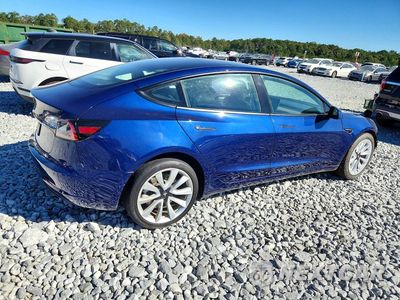 Trzecie zdjęcie samochodu z tyłu: 2023 TESLA MODEL 3 VIN:5YJ3E1EA7PF436314 - miniatura