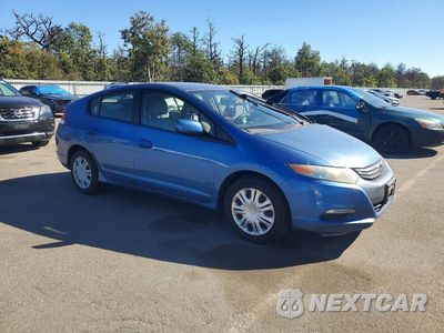 Czwarte zdjęcie samochodu z boku: 2010 HONDA INSIGHT LX VIN:JHMZE2H54AS035679 - miniatura