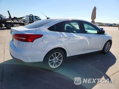 Trzecie zdjęcie samochodu z tyłu: 2018 FORD FOCUS SE VIN:1FADP3F28JL302570 - miniatura