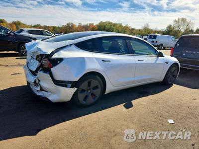 Trzecie zdjęcie samochodu z tyłu: 2022 TESLA MODEL 3 VIN:5YJ3E1EB0NF107489 - miniatura