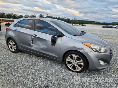 Czwarte zdjęcie samochodu z boku: 2013 HYUNDAI ELANTRA GT BASE VIN:KMHD35LE5DU044857 - miniatura