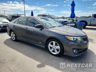 Czwarte zdjęcie samochodu z boku: 2014 TOYOTA CAMRY HYBRID SE VIN:4T1BD1FK4EU122044 - miniatura
