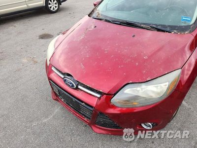 Zdjęcie 11 z 12 samochodu: 2014 FORD FOCUS TITANIUM VIN:1FADP3J24EL215133 - miniatura