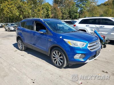 Czwarte zdjęcie samochodu z boku: 2017 FORD ESCAPE TITANIUM VIN:1FMCU9J94HUA47454 - miniatura