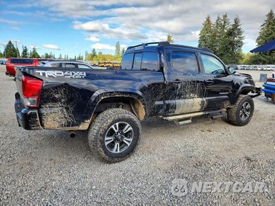 Trzecie zdjęcie samochodu z tyłu: 2016 TOYOTA TACOMA TRD SPORT VIN:3TMDZ5BN5GM002234 - miniatura