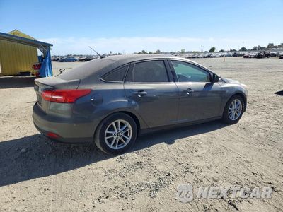 Trzecie zdjęcie samochodu z tyłu: 2016 FORD FOCUS SE VIN:1FADP3F27GL263169 - miniatura