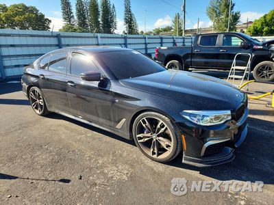 Czwarte zdjęcie samochodu z boku: 2018 BMW M550XI VIN:WBAJB9C52JB049875 - miniatura