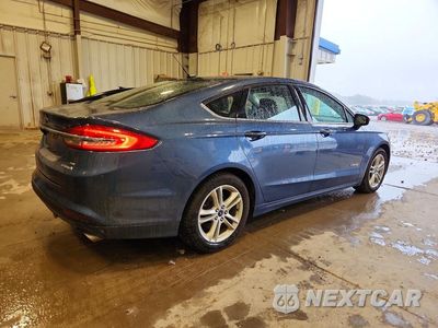 Trzecie zdjęcie samochodu z tyłu: 2018 FORD FUSION SE HYBRID VIN:3FA6P0LU9JR232396 - miniatura