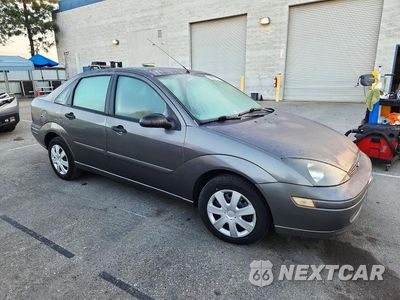 Czwarte zdjęcie samochodu z boku: 2004 FORD FOCUS SE COMFORT VIN:1FAFP34Z74W104784 - miniatura