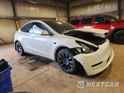 Czwarte zdjęcie samochodu z boku: 2022 TESLA MODEL Y VIN:7SAYGDEE9NF384754 - miniatura