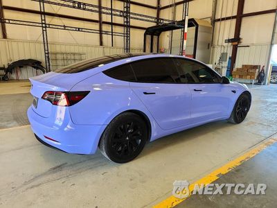 Trzecie zdjęcie samochodu z tyłu: 2023 TESLA MODEL 3 VIN:5YJ3E1EA3PF485106 - miniatura