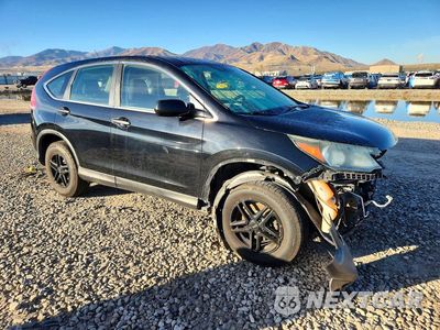 Czwarte zdjęcie samochodu z boku: 2014 HONDA CR-V LX VIN:5J6RM3H35EL012219 - miniatura