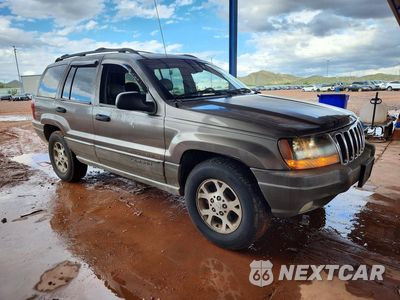 Czwarte zdjęcie samochodu z boku: 2000 JEEP GRAND CHEROKEE LAREDO VIN:1J4GW48N0YC241940 - miniatura