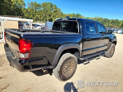 Trzecie zdjęcie samochodu z tyłu: 2023 TOYOTA TACOMA TRAIL SPECIAL EDITION VIN:3TMCZ5AN3PM621265 - miniatura