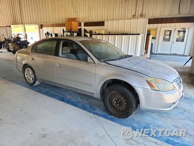 Czwarte zdjęcie samochodu z boku: 2003 NISSAN ALTIMA 2.5 VIN:1N4AL11D33C194003 - miniatura