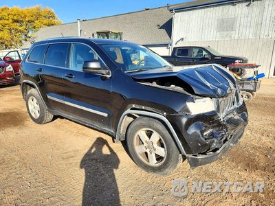 Czwarte zdjęcie samochodu z boku: 2012 JEEP GRAND CHEROKEE LAREDO VIN:1C4RJFAG8CC226051 - miniatura
