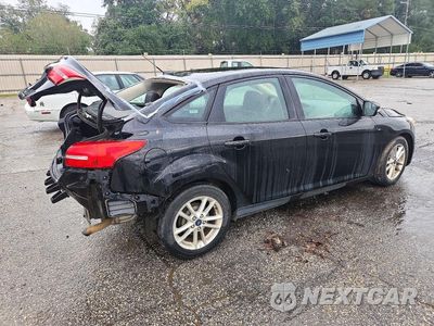 Trzecie zdjęcie samochodu z tyłu: 2016 FORD FOCUS SE VIN:1FADP3F21GL291503 - miniatura