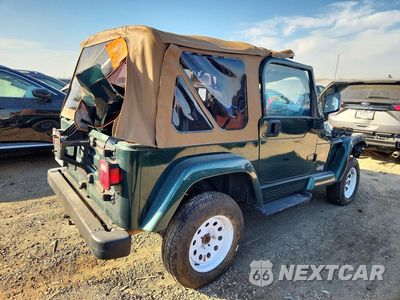 Trzecie zdjęcie samochodu z tyłu: 1999 JEEP WRANGLER / TJ SAHARA VIN:1J4FY49S9XP433150 - miniatura