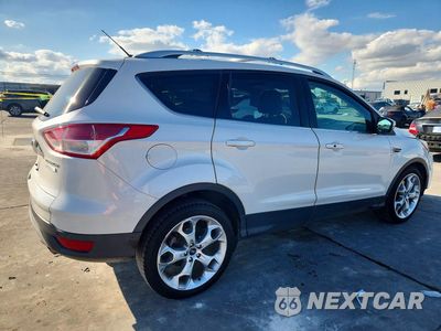 Trzecie zdjęcie samochodu z tyłu: 2014 FORD ESCAPE TITANIUM VIN:1FMCU0J95EUA11229 - miniatura