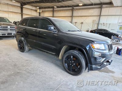 Czwarte zdjęcie samochodu z boku: 2014 JEEP GRAND CHEROKEE LAREDO VIN:1C4RJFAG5EC490086 - miniatura