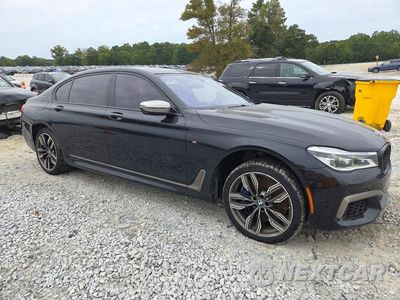 Czwarte zdjęcie samochodu z boku: 2018 BMW M760 XI VIN:WBA7H6C5XJG614853 - miniatura