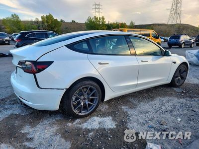 Trzecie zdjęcie samochodu z tyłu: 2022 TESLA MODEL 3 VIN:5YJ3E1EB7NF240749 - miniatura