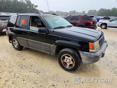 Czwarte zdjęcie samochodu z boku: 1997 JEEP GRAND CHEROKEE LAREDO VIN:1J4FX58S7VC724129 - miniatura