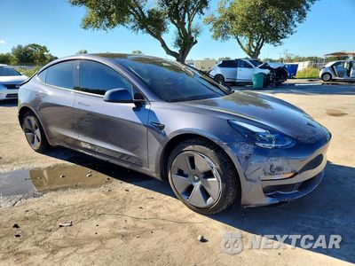 Czwarte zdjęcie samochodu z boku: 2023 TESLA MODEL 3 VIN:5YJ3E1EB3PF670538 - miniatura