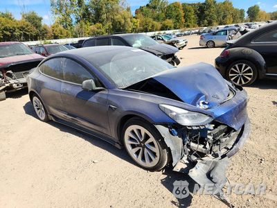 Czwarte zdjęcie samochodu z boku: 2021 TESLA MODEL 3 VIN:5YJ3E1EB0MF980741 - miniatura