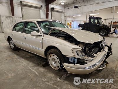 Czwarte zdjęcie samochodu z boku: 1999 LINCOLN CONTINENTAL VIN:1LNHM97V4XY718221 - miniatura