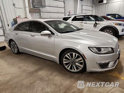 Czwarte zdjęcie samochodu z boku: 2017 LINCOLN MKZ SELECT VIN:3LN6L5C99HR601343 - miniatura